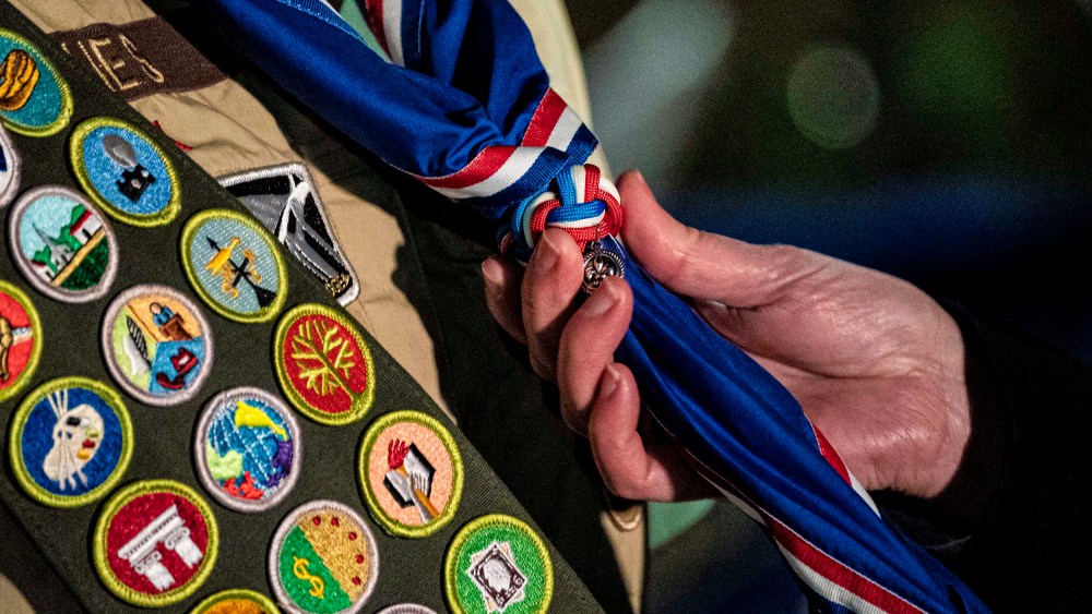 A scout receives a neckerchief.