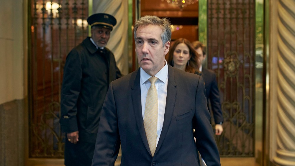 Michael Cohen departs his apartment building