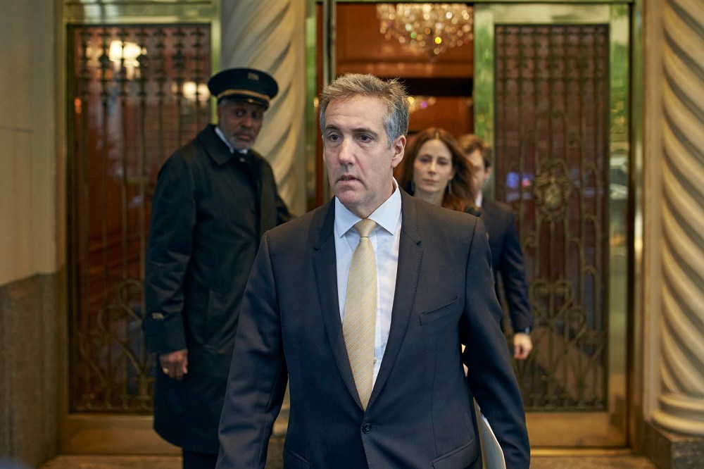 Michael Cohen departs his apartment building