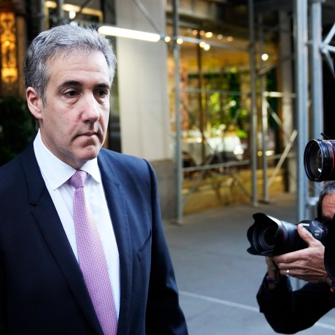 Photographers take pictures of Michael Cohen