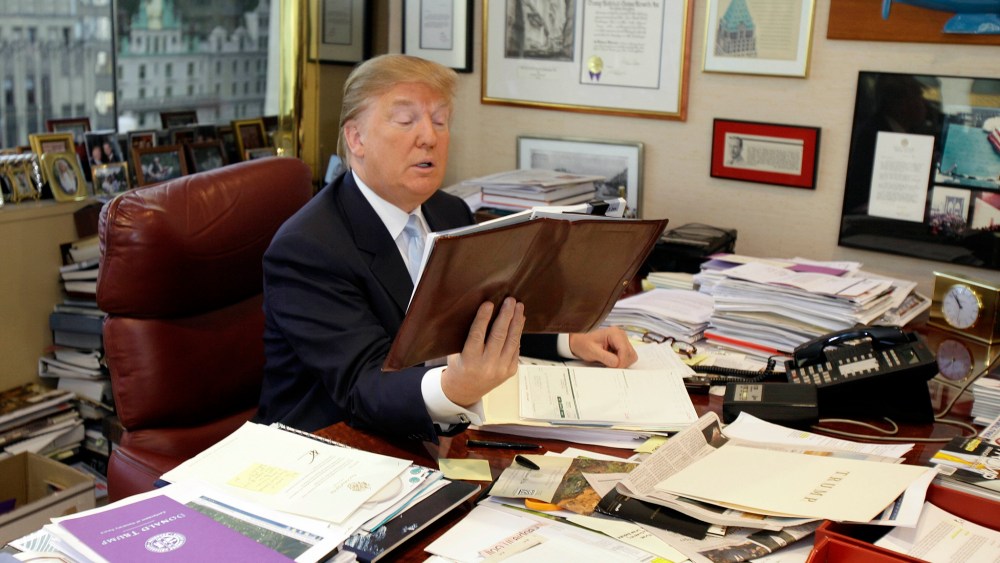 Donald Trump works at his desk in his New York office, Monday, Nov. 22, 2010