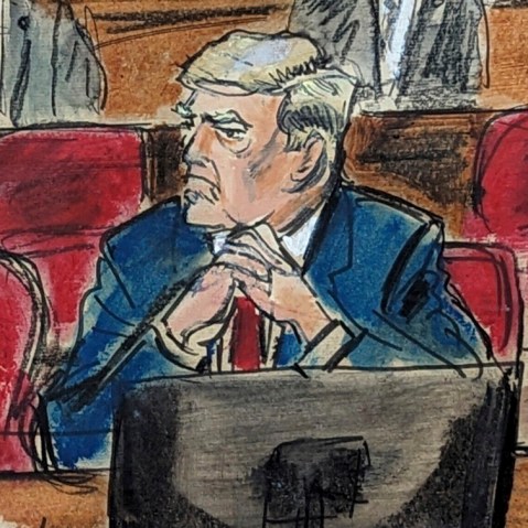 Donald Trump, center, listens as defense attorney Todd Blanche, left, responds to prosecutors in Manhattan criminal court in New York