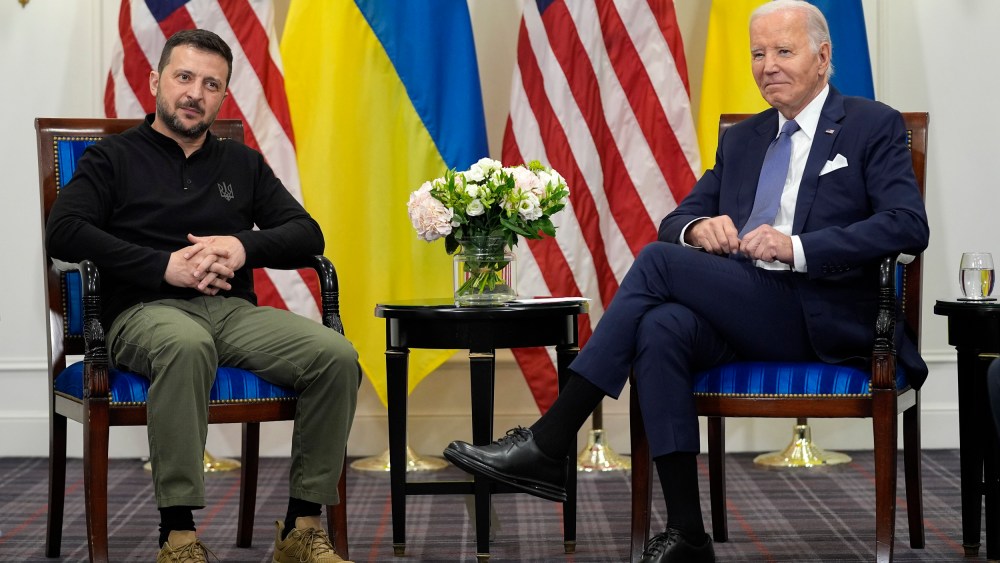 Joe Biden, right, meets with Volodymyr Zelenskyy in Paris