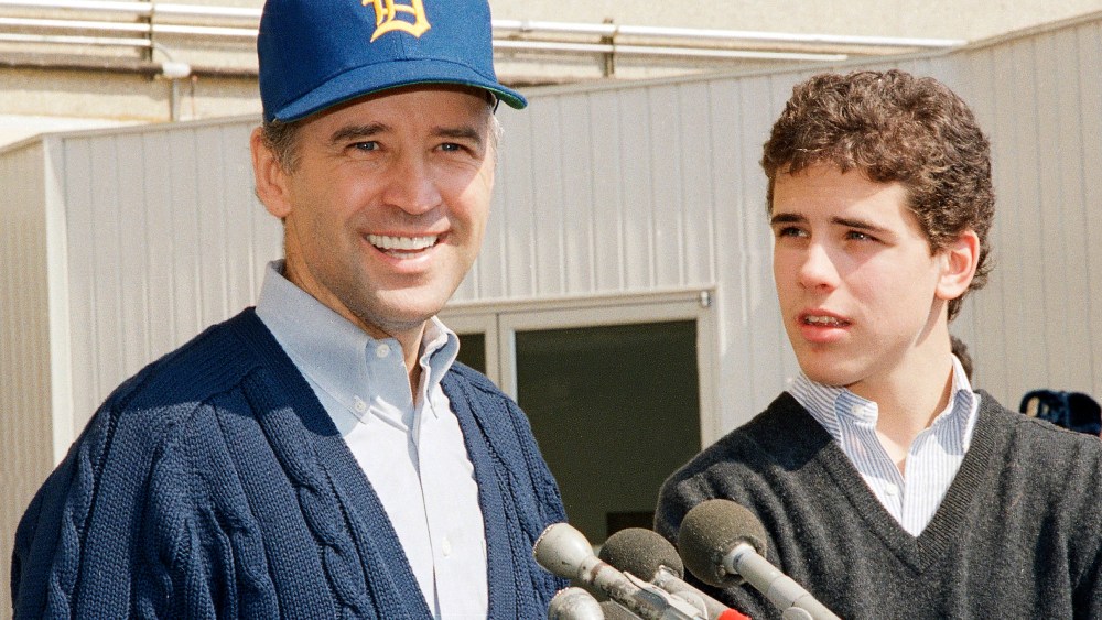 Sen. Joseph Biden, D-Del., wearing a University of Delaware baseball cap, leaves Walter Reed Army Hospital accompanied by his son Hunter Biden.
