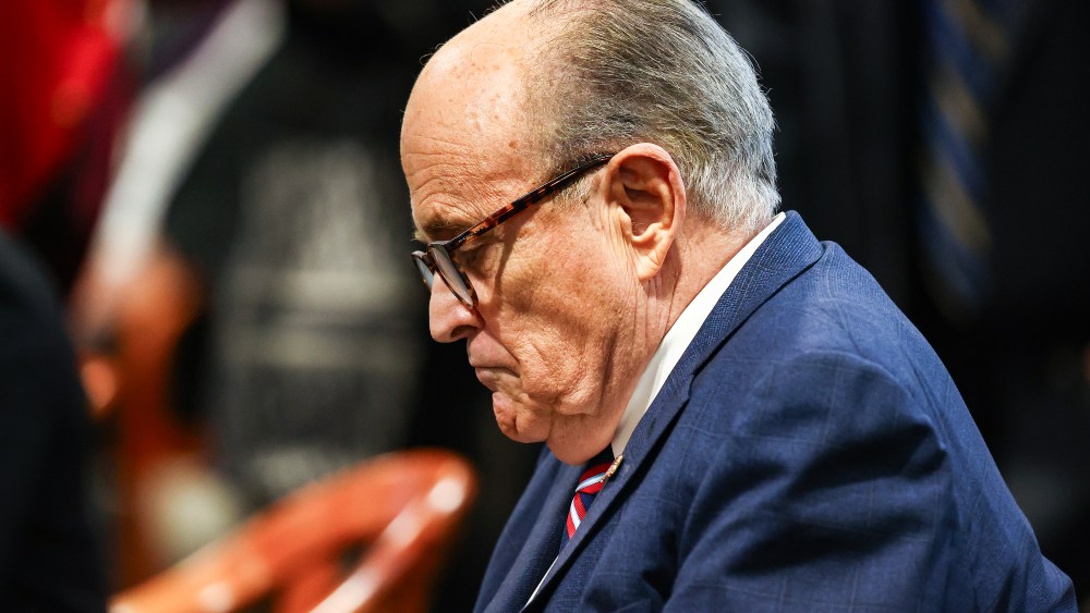 Rudy Giuliani side profile as he looks down