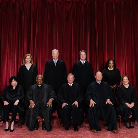 A split composite of smokestacks and SCOTUS.