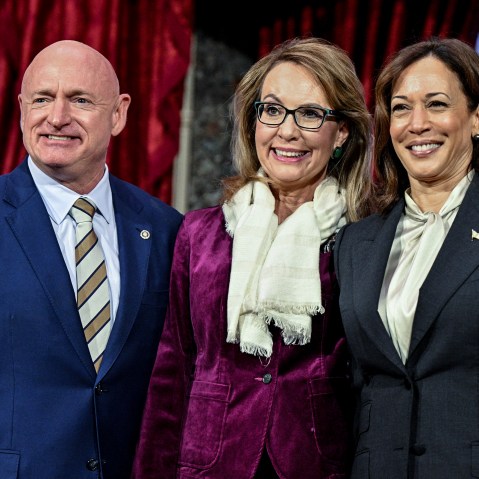 Sen. Mark Kelly, D-Ariz., poses with his wife and former U.S. Rep. Gabby Giffords and Vice President Kamala Harris