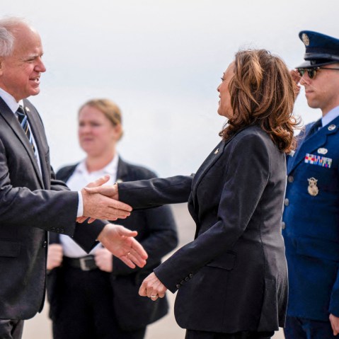 Tim Walz greets Kamala Harris.