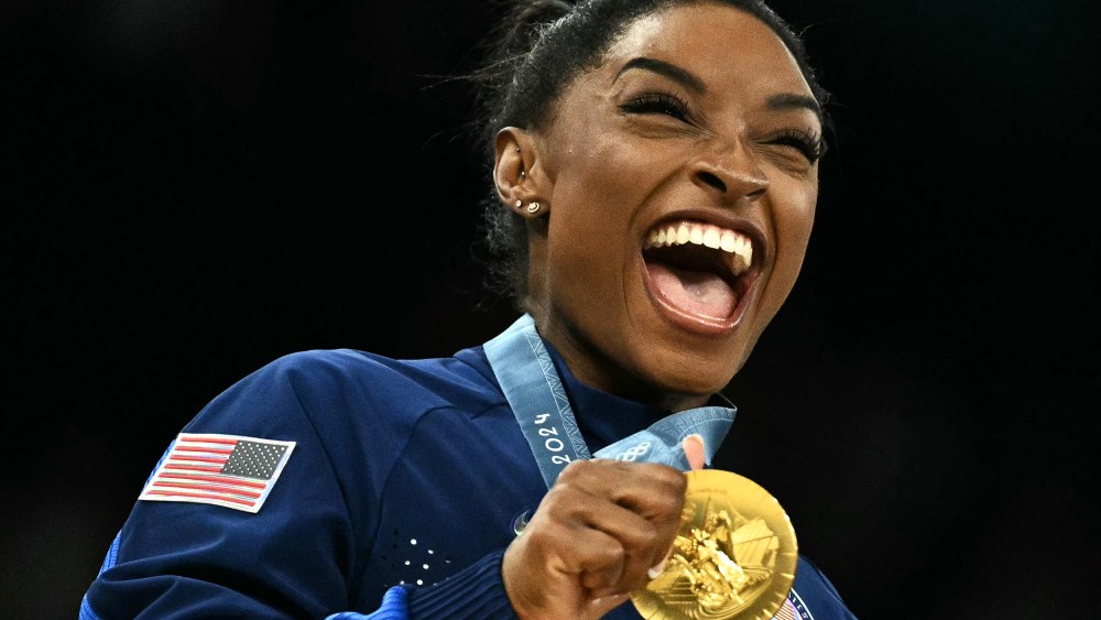 Image: simone biles gold medal gymnastics laugh smile happy