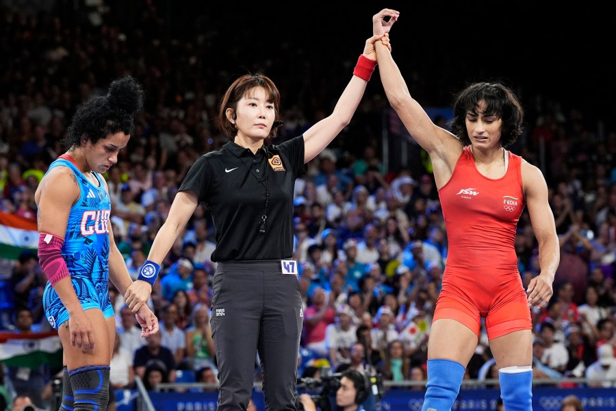 India's Vinesh Phogat celebrates during the women's freestyle 50kg wrestling semifinal match, at Champ-de-Mars Arena, during the 2024 Summer Olympics, Tuesday, Aug. 6, 2024, in Paris, France.