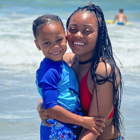 Amber Thurman and her son hug at the beach