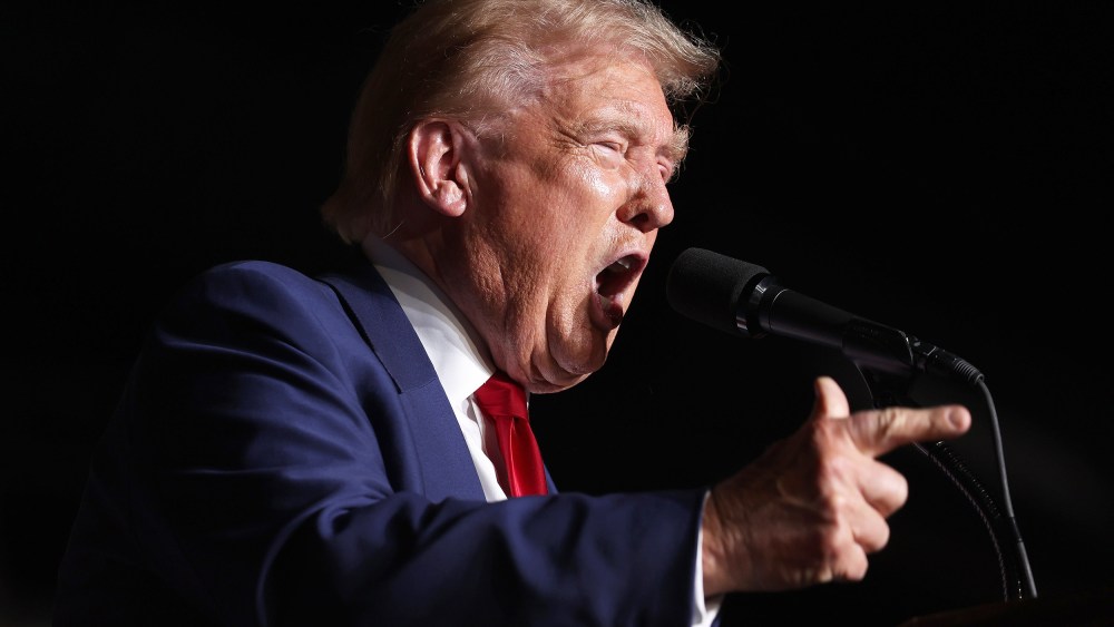 Image: Donald Trump profile mouth open speech finger point emotion
