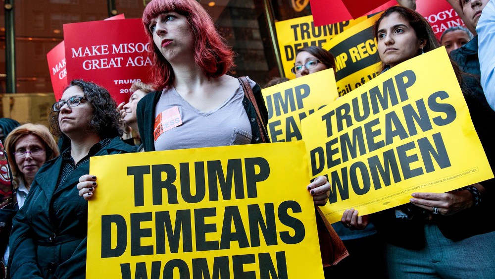 Activists rally during a protest against Donald Trump for his 'treatment of women'