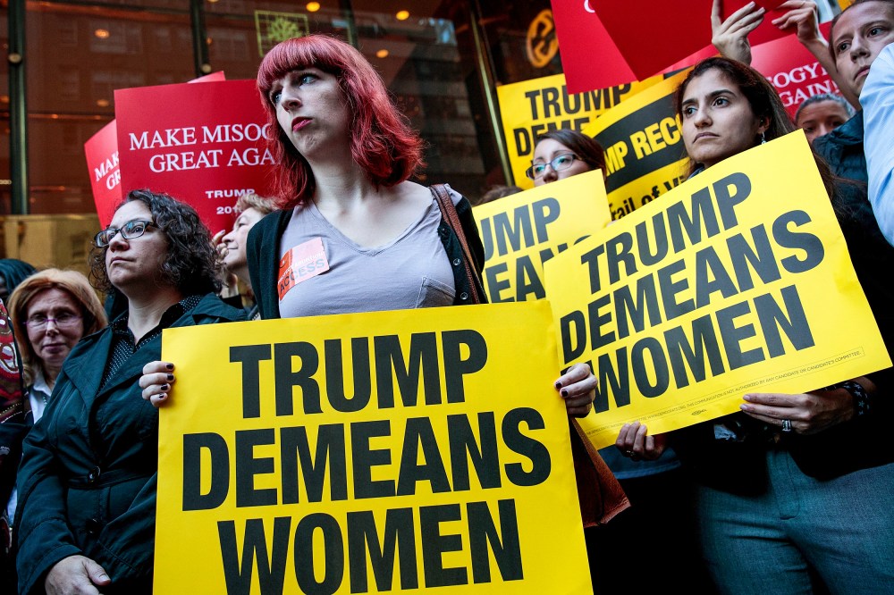 Activists rally during a protest against Donald Trump for his 'treatment of women'
