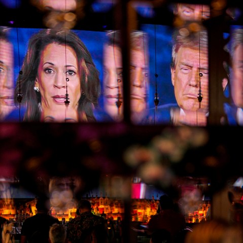 Harris and Trump on a screen at the debate night.