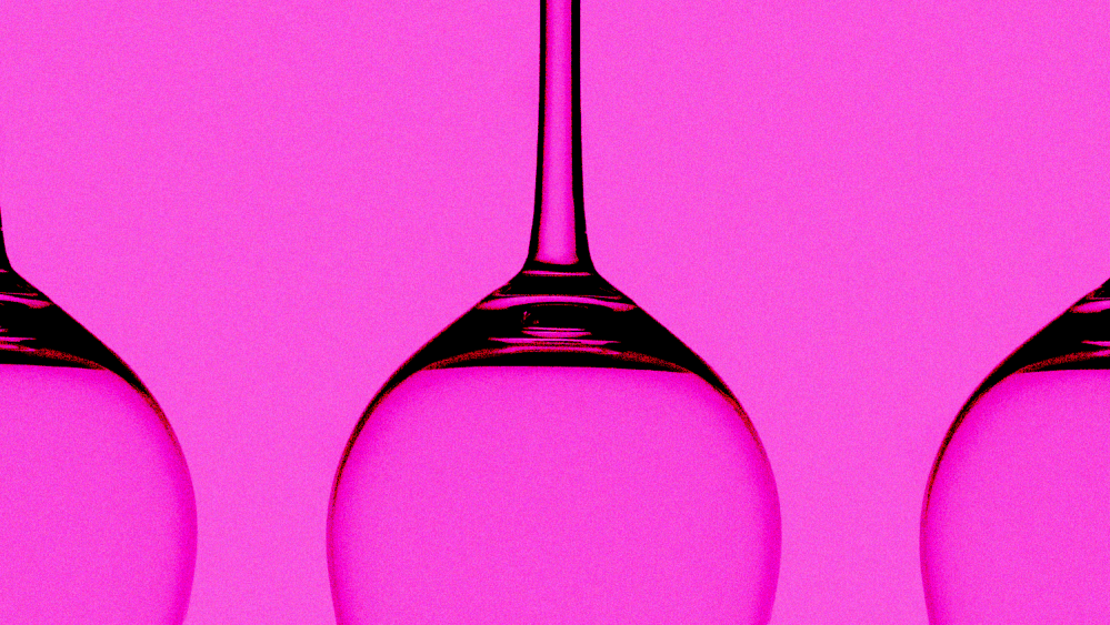 three empty, upside down wine glasses