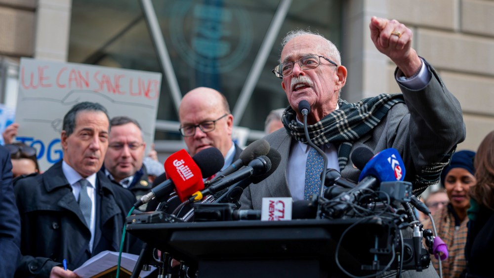 Gerry Connolly speaks outside the USAID headquarters.