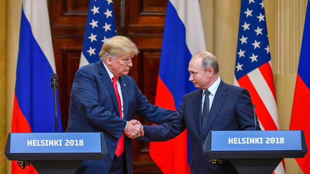 President Donald Trump and Russia's President Vladimir Putin shake hands