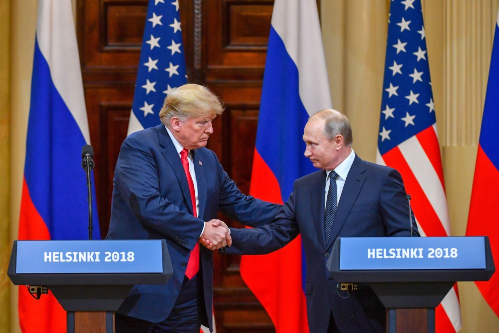President Donald Trump and Russia's President Vladimir Putin shake hands