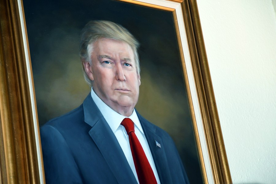 A painting on Donald Trump is hung on a wall