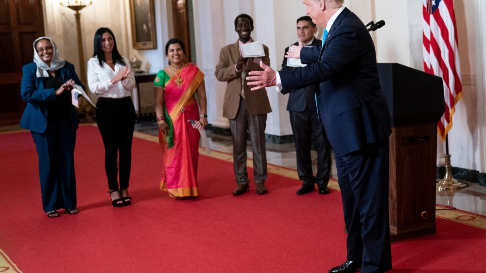 President Donald Trump  greets attendees.
