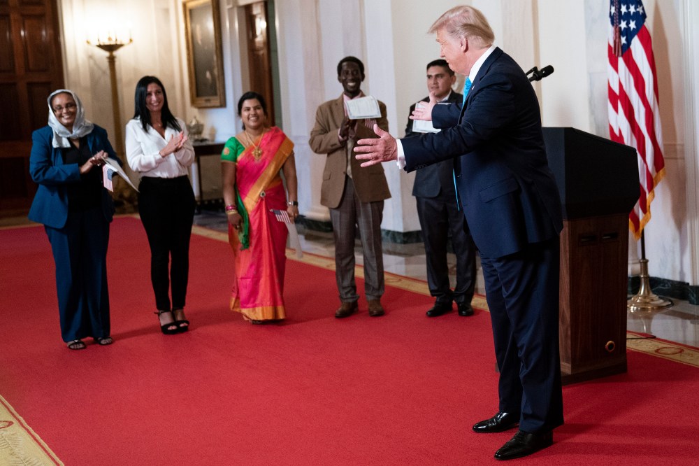 President Donald Trump  greets attendees.