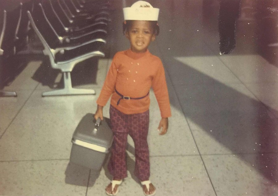 Six year old Stephanie McKee boarding her first flight at New Orleans International Airport.