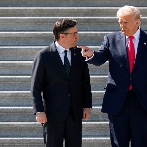 Donald Trump and House Speaker Mike Johnson speaking on the steps of the Capitol