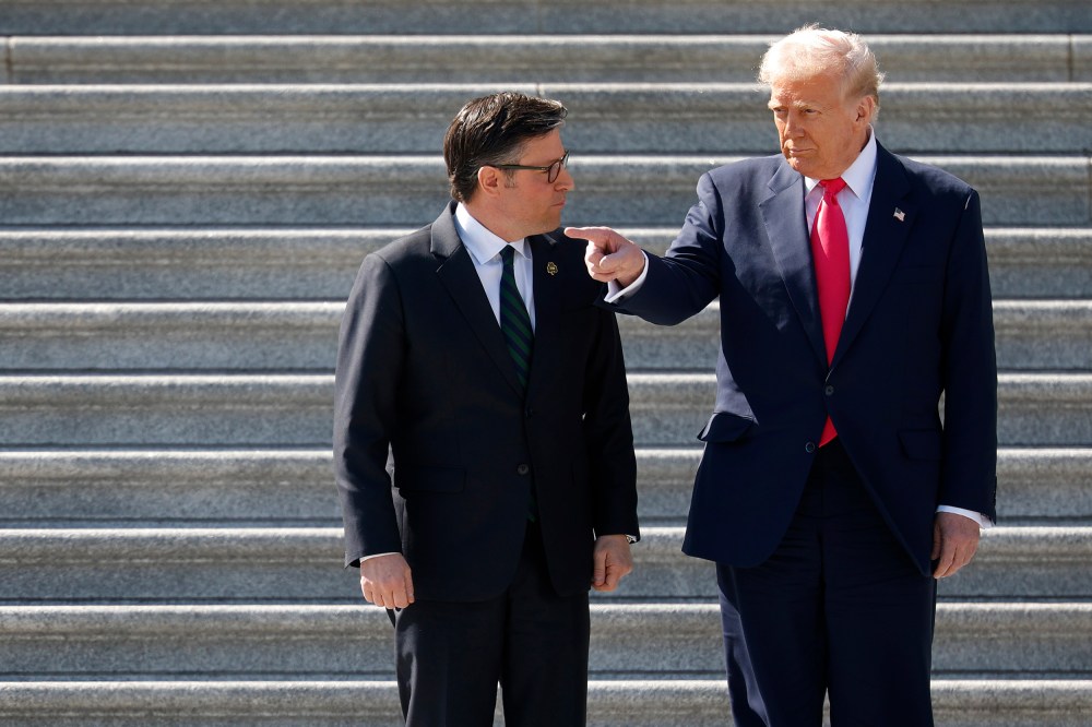 Donald Trump and House Speaker Mike Johnson speaking on the steps of the Capitol