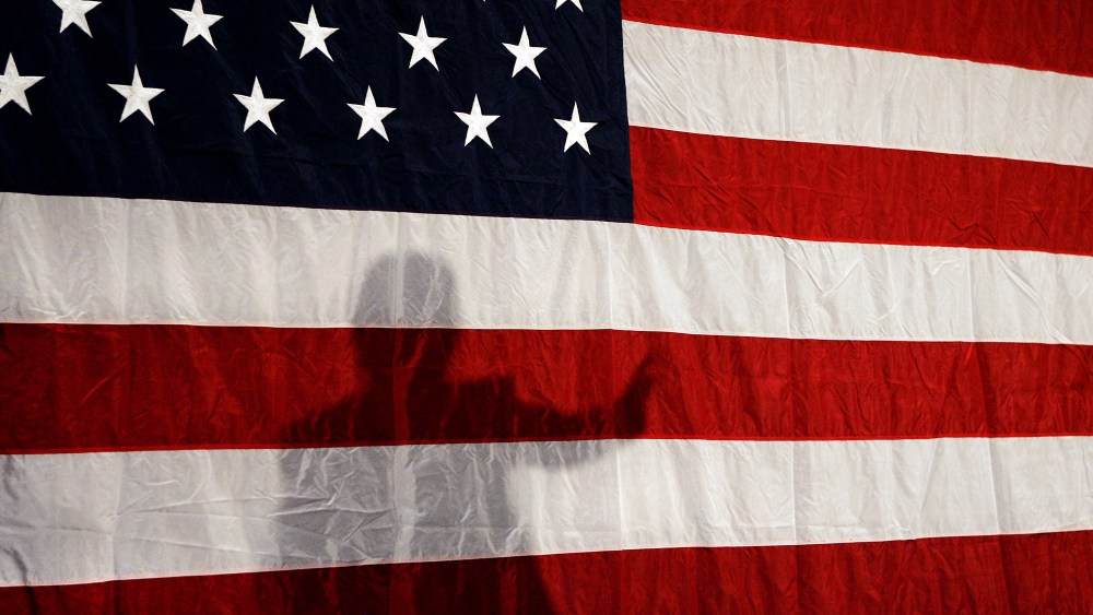 Shadow of a political candidate on a flag