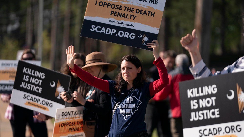 Demonstrators outside the department of corrections before the scheduled firing squad execution of inmate Mikal Mahdi on April 11, 2025 in Columbia, S.C.