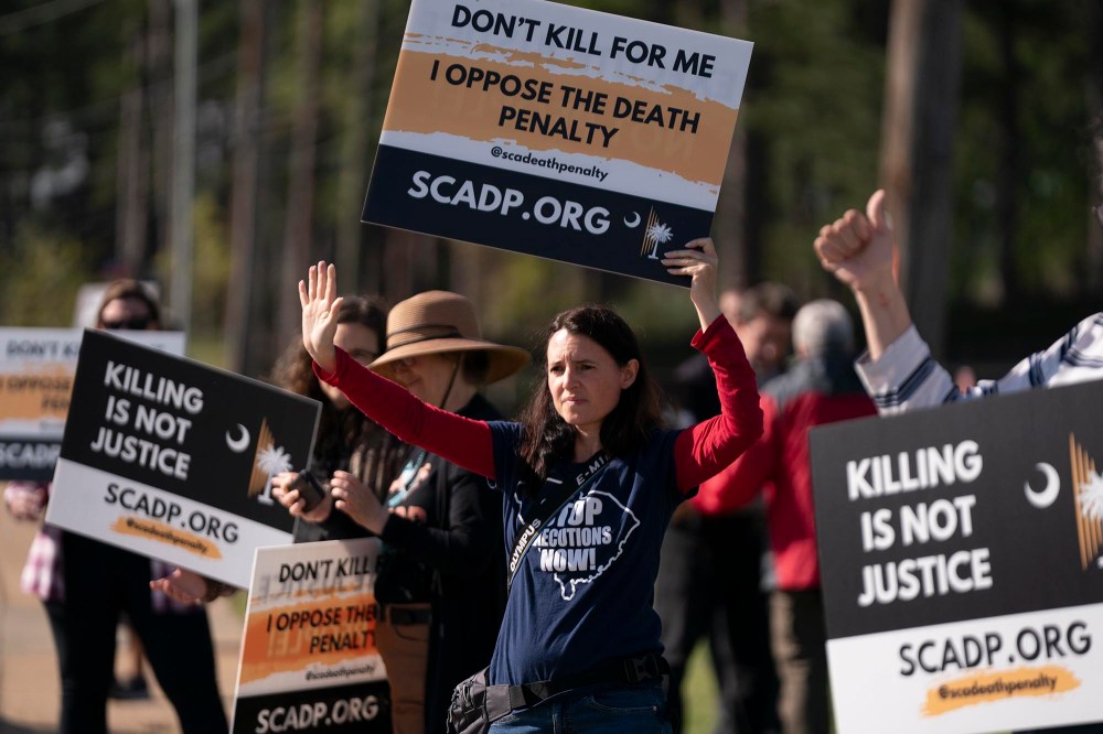 Demonstrators outside the department of corrections before the scheduled firing squad execution of inmate Mikal Mahdi on April 11, 2025 in Columbia, S.C.