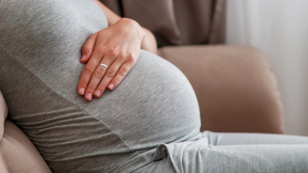 Pregnant woman on couch