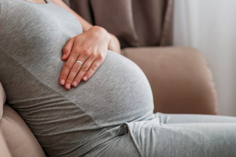 Pregnant woman on couch