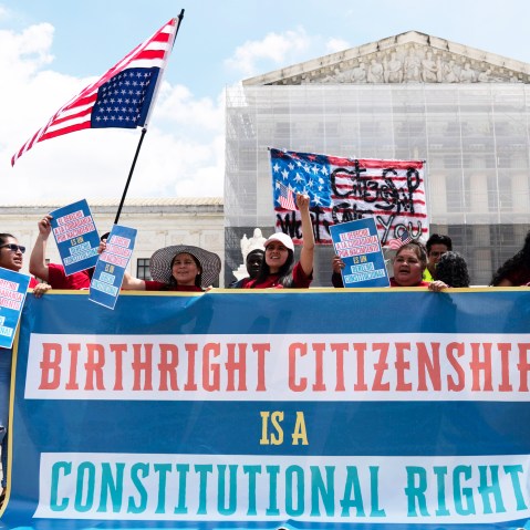 Demonstrators holds a banner  that reads, "Birthright Citizenship is a Constitutional Right"