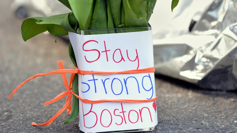Flowers and a message are left on Newbury Street April 16, 2013 in Boston, Massachusetts, a few blocks from where two explosions struck near the finish line of the Boston Marathon on Monday. Three people, including a child, were killed and more than...