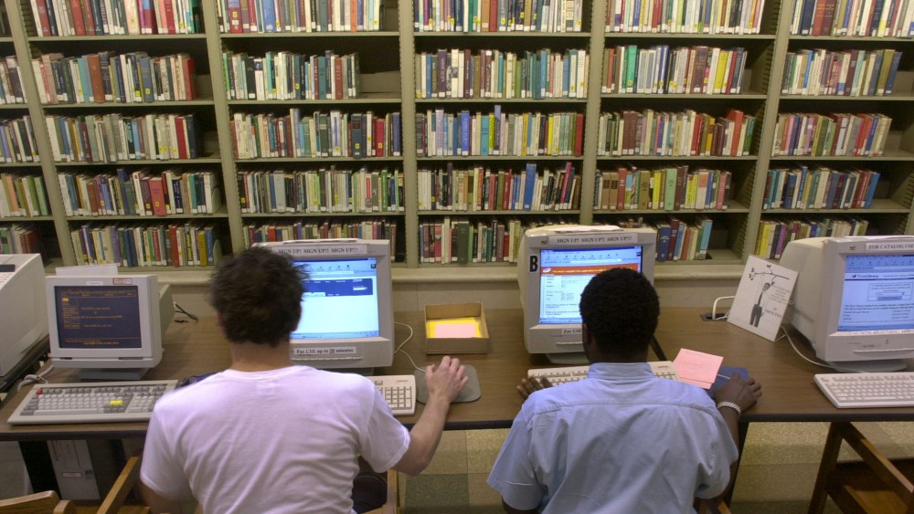 **FILE**Internet users work at computers at the Philadelphia Public Library in Philadelphia on May 31, 2002.