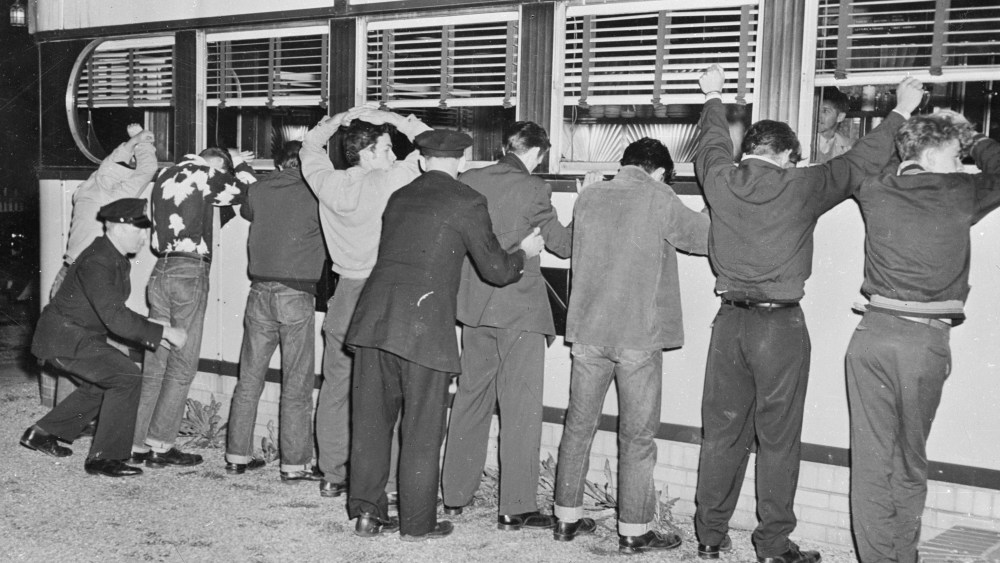 File Photo: 28th May 1951:  New York Police frisking youths after fighting erupted between rival gangs in Queens' Village.  (Photo by Keystone/Getty Images/File)