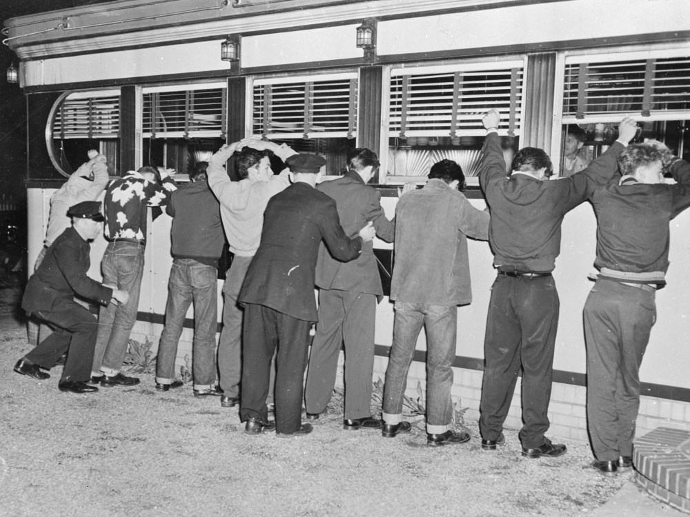 File Photo: 28th May 1951: New York Police frisking youths after fighting erupted between rival gangs in Queens' Village. (Photo by Keystone/Getty Images/File)