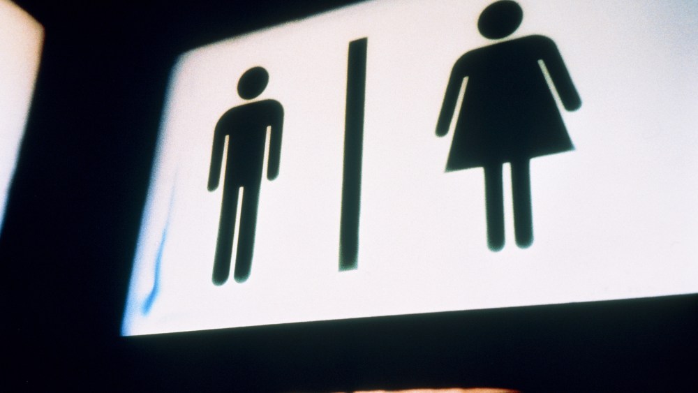 A sign for men and women's bathrooms. (Photo by Vincent Mo/Corbis)