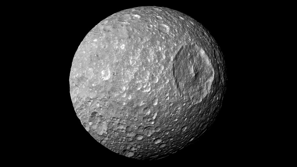 In this view captured by NASA's Cassini spacecraft on its closest-ever flyby of Saturn's moon Mimas, large Herschel Crater dominates Mimas, making the moon look like the Death Star in the movie "Star Wars."