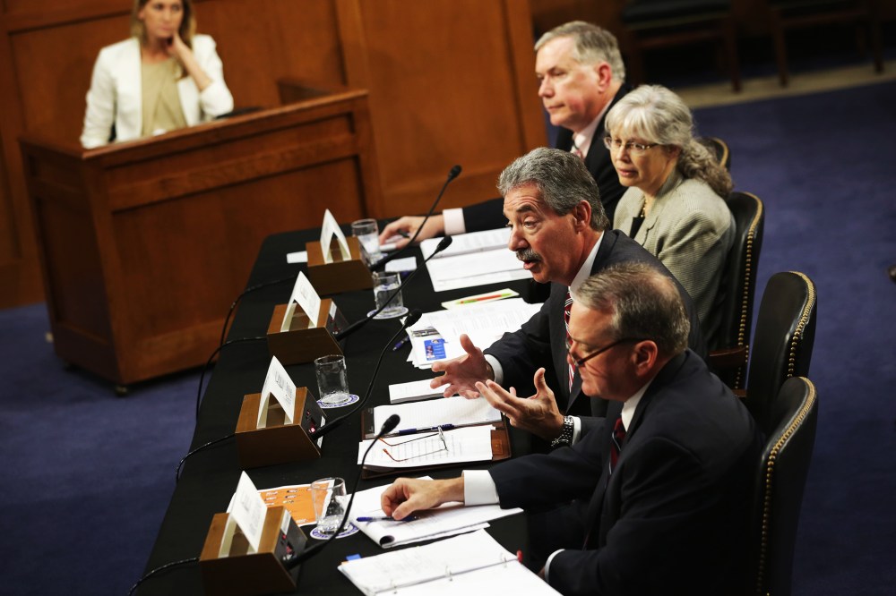National Security Agency Deputy Director Richard Ledgett, Principal Deputy Director of National Intelligence Stephanie O'Sullivan, Deputy Attorney General James Cole, and FBI Deputy Director Mark Giuliano testify during a hearing before the Senate (Select