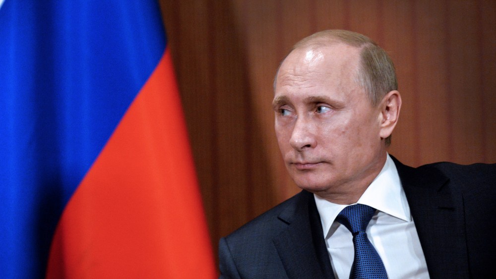 Russian President Vladimir Putin is seen during a meeting with and German chancellor (not seen) in Normandy Barriere hotel in Deauville on June 6, 2014.