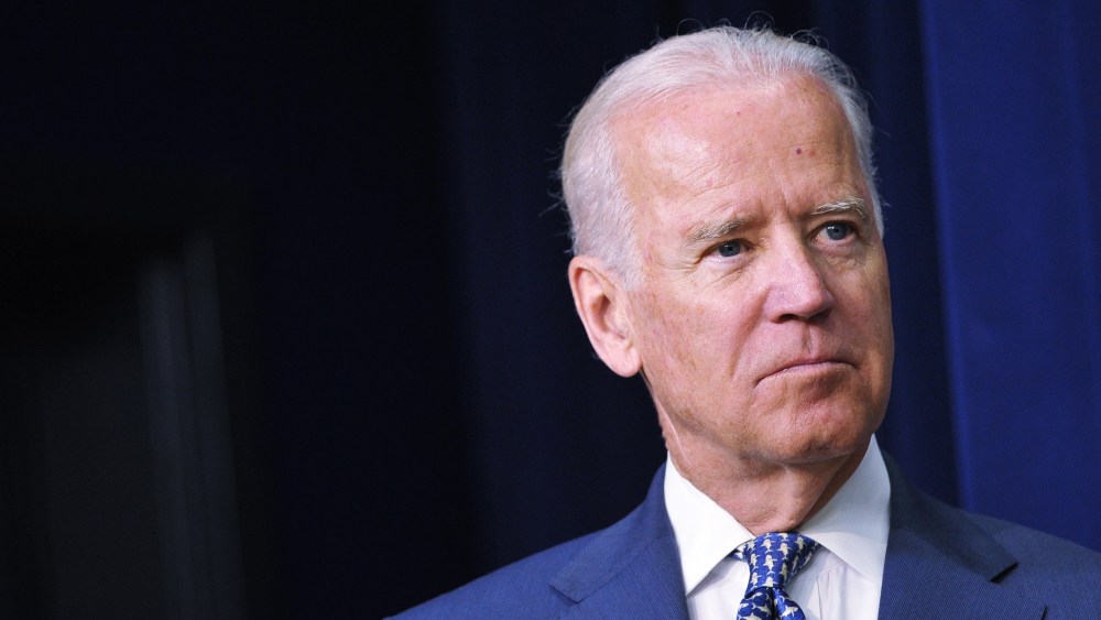 Vice President Joe Biden watches as President Barack Obama speaks during an event at the Eisenhower Executive Office Building on June 10, 2014 in Washington, D.C. (Photo by Mandel Ngan/AFP/Getty)