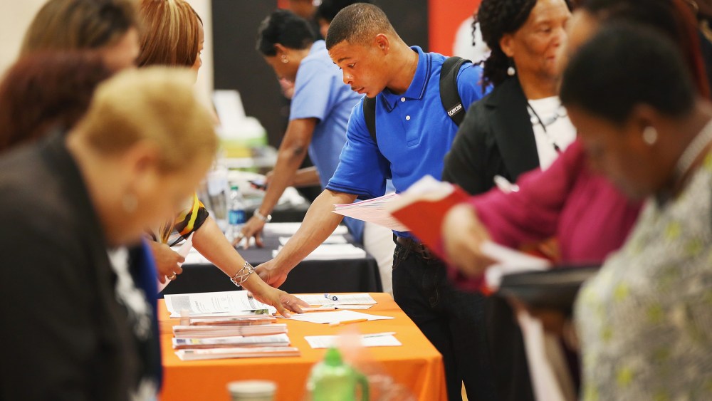 Job seekers check out opportunities at a job fair on June 12, 2014 in Chicago, Illinois.