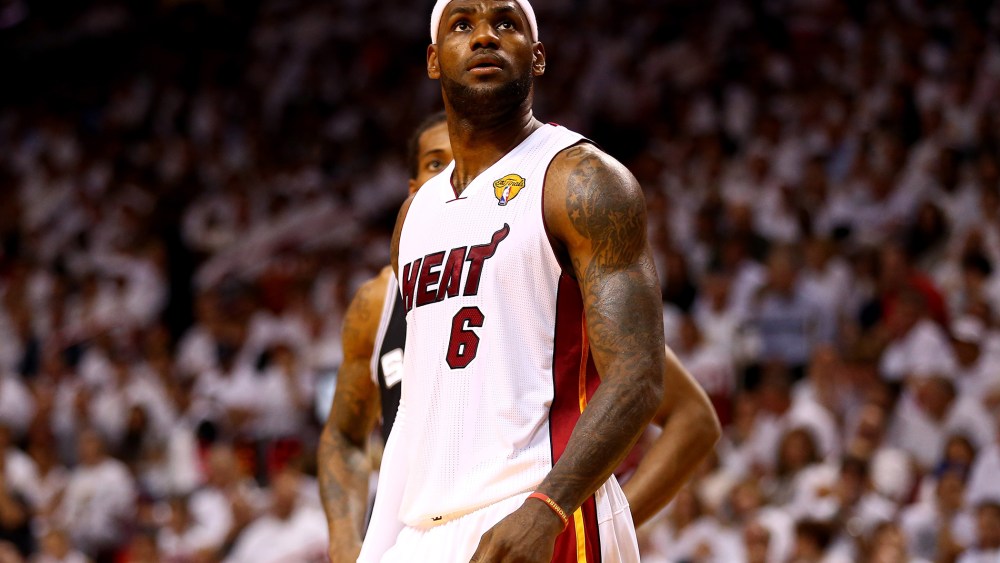LeBron James looks on against the San Antonio Spurs during Game Four of the 2014 NBA Finals, June 12, 2014 in Miami, Florida.