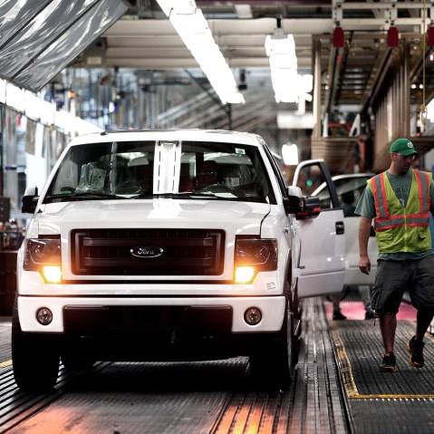 Ford F-150 trucks are prepared to come off the assembly line at the Ford Dearborn Truck Plant on June 13, 2014 in Dearborn, Mich.