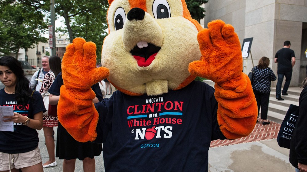 Opponents of Hillary Clinton stand outside Lisner Auditorium at GWU before Clinton speaks about her new book in Washington, June 13, 2014.