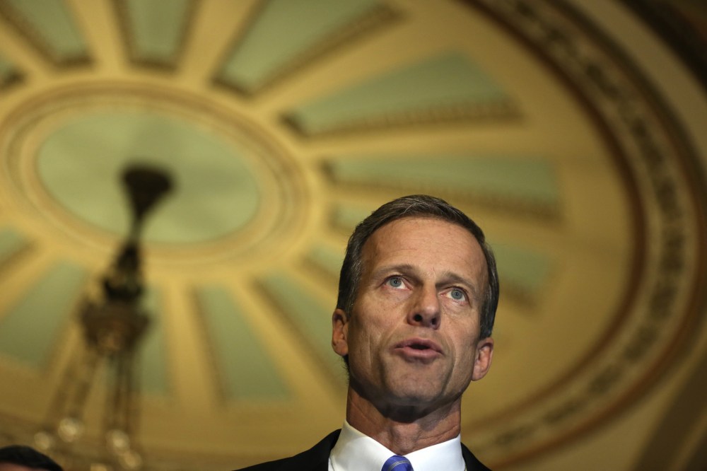 Senator John Thune (R-SD) speaks to members of the media, November 19, 2013 on Capitol Hill in Washington, D.C.