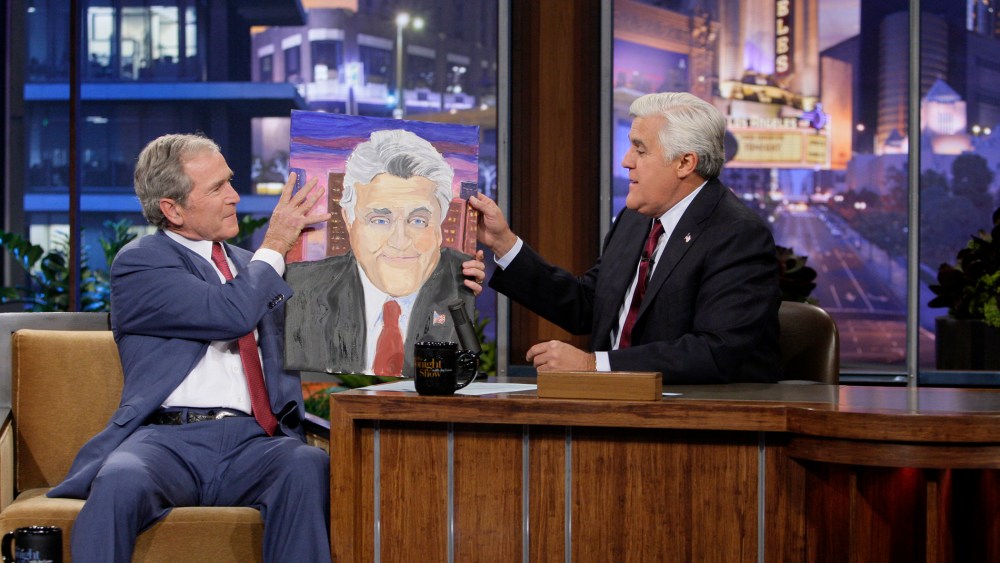 Former President George W. Bush presents Jay Leno with a portrait on Nov. 19, 2013